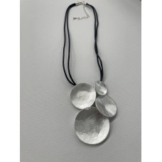 Four different size silver metal circles on a double-cord